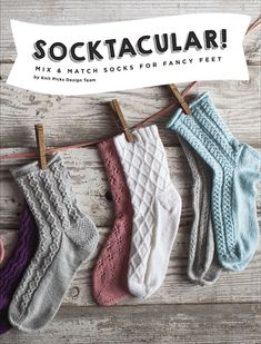 socks hanging on a clothes line with the words socktacular written above them