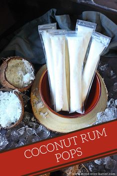 coconuts and sugar are sitting in bowls on the table with ice cubes around them