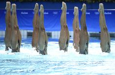 the olympic swimming team is performing their routine