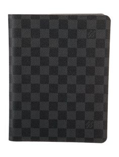 a black and grey checkered notebook