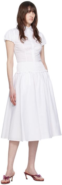 Stretch cotton poplin skirt. Gathering throughout. · Ruffles at shirred elasticized waistband · Two-pocket styling · Fully lined Supplier color: White Chic Midi Skirt With Gathered Waist, Spring Tiered Skirt With Gathered Waist, Cotton Tiered Skirt With Pleated Waist, Flowy Ruched Cotton Skirt, Fitted Ruched Cotton Skirt, Fitted Flared Skirt With Gathered Waist, Ruched Cotton Skirt, Midi Skirt With Gathered Waist For Work, Relaxed Ruched Skirt For Daywear