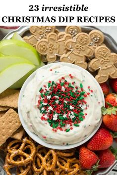 christmas dip with pretzels, strawberries and crackers on a platter