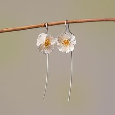 These Poppy Flower Drop Earrings, crafted from premium 925 silver, are an homage to the subtle power of nature's artistry. With petals that display a lifelike texture and a center delicately brushed with gold, they capture the wild and free essence of poppies in bloom. Lightweight and with a gentle sway, they offer a whisper of movement, a dash of sophistication to your daily wear or a statement piece for special occasions. Let these earrings be a symbol of resilience and beauty, mirroring the e Sterling Silver Flower Earrings As A Gift For Her, Mother's Day Sterling Silver Birth Flower Earrings, Mother's Day Sterling Silver Flower Earrings, Adjustable Sterling Silver Flower-shaped Earrings, Sterling Silver Adjustable Drop Flower Earrings, Mother's Day Silver Sterling Flower Earrings, Adjustable Sterling Silver Drop Flower Earrings, Mother's Day Nickel-free Sterling Silver Flower Earrings, Silver Flower-shaped Earrings For Her