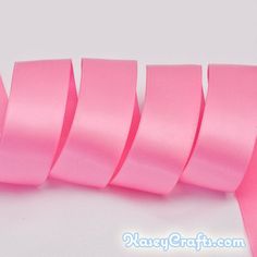 pink satin ribbon on white background