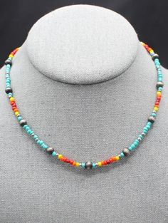 16" Multicolor Seed Bead and Faux Pearl Necklace This 16" turquoise multi-beaded seed bead necklace features a burnished silver finish bead for a look that is both fashionable and timeless. Lobster claw closure with 2" extender chain. Turquoise Heishi Beads Jewelry With Beaded Chain, Tiny Beads Southwestern Jewelry, Multicolor Polished Beads Southwestern Necklace, Multicolor Beaded Southwestern Turquoise Necklace, Southwestern Multicolor Polished Beaded Necklaces, Turquoise Jewelry With Colorful Metal Beads, Beaded Turquoise Necklace With Heishi Beads, Adjustable Beaded Multicolor Turquoise Necklace, Adjustable Multicolor Turquoise Necklace With Tiny Beads