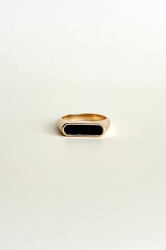 Elevate any outfit with the Emelia Black Ring. Made with 18K gold plating and a black enamel rectangle, this statement ring adds a touch of edginess to your look. Stand out and make a bold statement with this piece! All of our jewelry comes with a free jewelry pouch and cloth to keep your pretties safe and clean. Details Color: 18K Gold PlatedMaterial: Stainless SteelSize: 6, 7, 8 Care Guide Store in a dry, cool place away from sunlight i.e. Blush & Bliss pouch Gently wipe with a soft cloth afte Elegant Black Signet Ring For Everyday, Elegant Black Everyday Signet Ring, Black Minimalist Signet Ring For Everyday, Black 14k Gold Open Signet Ring, Elegant Black Rectangular Signet Ring, Black Rectangular Signet Ring For Formal Occasions, Elegant Onyx Rectangular Signet Ring, Elegant Gold Signet Ring With Black Enamel, Black Minimalist Signet Ring For Formal Occasions