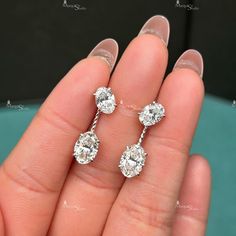 Center Stone Details : → Stone Shape: Oval Cut Moissanite → Weight : 5.00 Ctw (One Piece 2.50 Ctw) → All Stone : Moissanite → Color: White → Clarity: VVS1 → Luster: Excellent → Make: High Quality Custom make your jewelry with DutchMarquiseStudio * DutchMarquiseStudio accepts customized and personalized orders. * We make jewelry in Silver, 10k, 14k, 18k white/yellow/rose gold. * We do make jewelry using moissanite, diamonds, or birthstones/gemstones * Process of customization is fun and simple wi Gia Certified Oval Wedding Earrings, Oval Diamond Earrings With Vvs Clarity For Wedding, Oval Vvs Clarity Diamond Earrings For Wedding, Oval Brilliant Cut Diamond Earrings For Wedding, Oval Diamond White Diamond Earrings For Wedding, Oval Diamond White Wedding Earrings, Oval Diamond White Earrings For Wedding, White Gold Diamond Earrings, Daughters Day