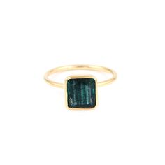 Azure Square Tourmaline Signet Ring featuring a blue green square shaped tourmaline set in a stylish modern signet ring. - Natural tourmaline approx. 3.60 karats.- 22 karat ion plated gold over sterling silver.- Gemstone dimensions approx. 10mm square.- Size 7, resizable. Modern Jewelry With Rectangular May Birthstone, Modern Rectangular May Birthstone Jewelry, Modern Emerald Ring With Rectangular Stone, Modern Yellow Gold Tourmaline Jewelry, Modern Rectangular Emerald Ring, Modern Gold Tourmaline Jewelry, Modern Tourmaline Emerald Cut Rings, Modern Tourmaline Rings With Emerald Cut, Modern Tourmaline Rings In Emerald Cut