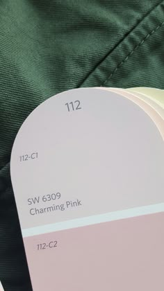 four different shades of pink and white on a person's green pants with the label labeled sw 6009 charming pink