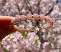 "Handmade 14k Gold Filled Wire Wrapped Rose Quartz and 14k Gold Bracelet for women. Brilliant Rose Quartz 6mm Beads. Natural Gemstone, Crystal Healing Energy. This bracelet features an adjustable chain and spring ring clip, so it should fit any wrist. This bracelet is a must have for pink gemstone lovers ♡♡ Makes a Beautiful Gift ♡♡ Rose Quartz: Self Love, Joy and enthusiasm, Unconditional Love, Inner Peace, and, Connection * Rose Quartz 6mm beads * 14k Gold filled bracelet wire  * Gemstones are 100% genuine  ♡ View the store here: usagimarshmellow.etsy.com ♡Follow on instagram: instagram.com/usagimarshmellow L E N G T H This bracelet measures 6.5\"- 8' and has an adjustable chain so it will fit most wrists. Please message me if you have any concerns or want some extra help ♡ G I F T I N G Rose Gold Jewelry With 8mm Beads For Gift, Rose Gold Rose Quartz Jewelry With 8mm Beads, Hand-wrapped Rose Quartz Bead Jewelry, Wire Wrapped Rose, Ring Clip, Healing Gemstone Bracelets, Gold Armband, Rose Quartz Bracelet, Gold Bracelet For Women