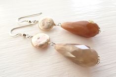 "Drop earrings with faceted beige sunstone and freshwater pink pearls. LENGTH: 2.6 inches - 6,5 cm - 6,4 gr. each MATERIALS: 925 Sterling Silver Sunstone: it is linked to luck and good fortune. Sunstone instills good nature, heightens intuition and allows the real self to shine . It alleviates stress and increases vitality. Encourages independence and originality. Sunstone facilitates self-empowerment and independence. It acts as an antidepressant. Increases self worth and confidence. Encourages Elegant Nickel-free Briolette Earrings, Elegant Natural Stone Pearl Earrings For Anniversary, Silver Pearl Earrings With Natural Stones, Elegant Sterling Silver Pearl Earrings With Natural Stones, Elegant Sterling Silver Earrings With Natural Stones, Elegant Silver Pearl Earrings With Natural Stones, Silver Pearl Earrings With Natural Stones In Sterling Silver, Silver Sterling Silver Pearl Earrings With Natural Stones, Elegant Silver Earrings With Natural Stones