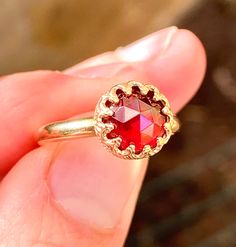 Round, 8mm, rose cut, 2-carats, natural, Mozambique, Red Garnet ring, set in crown bezel 14K yellow gold filled. Ring size: 7. Red Rose Cut Diamond Birthstone Ring, Elegant Faceted Round Ruby Ring, Elegant Faceted Ruby Ring, Red Rose Cut Diamond Rings For Proposal, Gold Faceted Ruby Ring For Anniversary, Faceted Ruby Ring For Anniversary, Gold Faceted Ruby Ring, Faceted Ruby Ring For Wedding, Faceted Round Ruby Ring