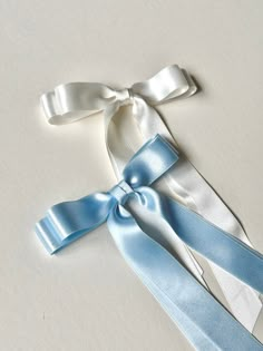 "Looking for the perfect transitional accessory for your reception? Need Something Blue? These 100% Silk Satin bows are next level luxury. The Warm White is natural, not too optic and not too cream.  Made with High Quality Silk Satin Ribbon, it's delicate and double faced. Please read descriptions for size/proportion and fastener specifications, as these are made to order.  Note: Silk Satin is delicate. Handle with extreme care to avoid snags. I recommend spraying your hairspray before applying Luxury Silk Bow For Formal Occasions, Luxury Silk Bow In Elegant Style, Blue Bow Aesthetic, Blue Ribbon Aesthetic, Luxury Ribbon Bow For Wedding, Luxury Classic Satin Bow, White Satin Hair Bow, Bridal Bow, Blue Coquette