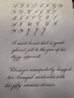 an old fashioned calligraphy is displayed on a piece of paper