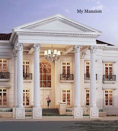 a large white building with columns and pillars on the front entrance to it at night