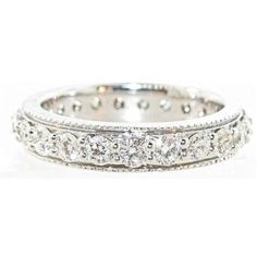 a white gold wedding band with round cut diamonds