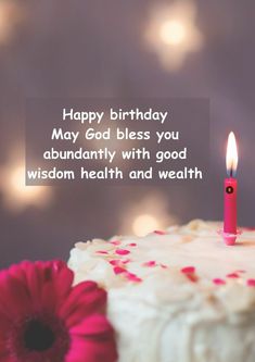 a birthday cake with a lit candle on it that says happy birthday may god bless you abundantly with good wisdom