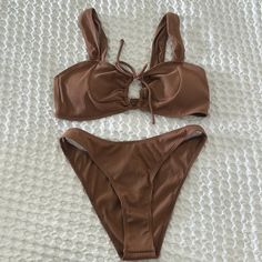 Never Worn. Brown One-piece Swimwear For Summer, Brown One-piece Swimwear For Sunbathing, Brown One-piece Swimwear For Beach, Brown Sleeveless Swimwear For Sunbathing, Brown Lined Swimwear For Poolside, Poolside Brown Lined Swimwear, Brown One-piece Swimwear For Beach Season, Brown Underwire Swimwear For Vacation, Brown Lined Swimwear