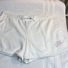 Nike Shorts. Nwot, Brand New, Never Worn. So Practical And Comfortable, You’ll Wear Them All Summer, Perfect For Your Next Vacation! Elastic Drawstring Waistband With Two Side Pockets And Nike Swoosh Logo On Left Side. 80% Cotton/20% Polyester. Machine Washable. Smoke Free Home. White Leisure Shorts, Casual White Shorts For Leisure, Casual White Drawstring Bottoms, Casual White Bottoms With Drawstring, Comfortable White Shorts For Spring, Comfortable White Spring Shorts, White Leisure Shorts With Built-in Liner, Nike Cotton Bottoms With Drawstring, Comfortable White Bottoms With Built-in Shorts