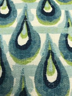 an abstract blue and green pattern on fabric