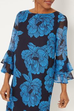 Tiered bell sleeves with ruffle detail 
 Floral print woven fabric 
 Round neckline with sheer yoke 
 Shift silhouette skims the figure 
 Keyhole back with button closure 
 Above knee length 
This charming shift dress from Wallis features a navy blue floral print with a sheer yoke overlay and flattering tiered bell sleeves. The lightweight woven fabrication flatters the figure with its shift silhouette and straight hem.
Style this versatile dress for a variety of occasions, from garden parties to summer weddings. Pair with heeled sandals or wedges and a clutch for a refined semi-formal look. For casual daywear, match with ballet flats and a crossbody bag. The floral print and ruffled sleeves make this an ideal choice for attending spring and summer events. Floral Evening Dresses, Holiday Shoes, Shoes Boots Ankle, Wide Fit Shoes, Occasion Shoes, Versatile Dress, Garden Parties, Summer Weddings, Blue Floral Print