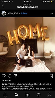 a man and woman posing for a photo with the word home in front of them