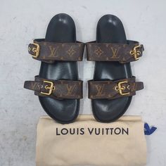 Louis Vuitton Brown Buckle Bom Dia Monogram Flat Slide Sandals Size Eu 38 Us 8 Womens Comes With Dustbag 100% Authentic *Price Is Firm* Color: Cacao Brown Classic Dark Brown Slip On Sandal With Allover Lv Monogram Print Patent Monogram Canvas Adjustable Strap Anatomic Insole Smooth Outsole Louis Vuitton-Engraved Buckle Please Note Signs Of Wear On Bottom And Footbed As Shown. Please Note Scratches/Scuffs Have Been Polished Over As Shown 8.1 Louis Vuitton Brown, Lv Monogram, Monogram Prints, Louis Vuitton Shoes, Monogram Canvas, Slide Sandals, Slip On Sandal, Women's Shoes Sandals, Black And Brown