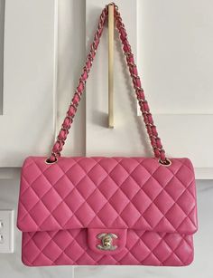 100% AUTHENTIC! CHANEL Caviar Quilted Medium Double Flap This is the most perfect Barbie Pink! Base length: 9.75 in Height: 5.75 in Width: 2.75 in Drop: 9.75 in Drop: 17.25 in This bag is in GOOD condition - no scratches, no corner wear or color transfer. Very minor indentions on the leather (see last 3 pics). This is an authentic CHANEL Caviar Quilted Medium Double Flap in Dark Pink. This shoulder bag is crafted of diamond quilted caviar leather in pink. This bag features a polished light gold chain-link shoulder strap threaded with leather and a frontal flap with a matching gold Chanel CC turn lock. The flap opens to reveal an inner flap and matte pink leather interior with patch pockets. Pink Lifestyle, Gold Chanel, Matte Pink, Luxury Purses, Chanel Caviar, Diamond Quilt, Luxury Brands, Classic Flap, Pink Leather