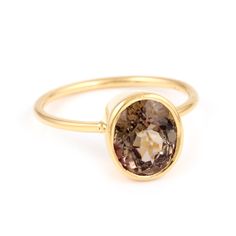 Chocolate Tourmaline Signet Ring featuring a chocolate brown oval tourmaline set in a stylish modern signet ring. - Natural chocolate Tourmaline - Set in 22 karat ion plated gold over sterling silver.- Gem dimensions approx. 10mm length.- Size 8, resizable. Gold Oval Tourmaline Ring, Modern Gold Tourmaline Rings, Tourmaline Ring, Signet Ring, Chocolate Brown, Tourmaline, Gems, Plating, Sterling Silver