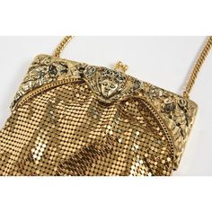 Rare vintage Whiting & Davis Co. gold mesh chainmail purse with frame that features a centralized face among leaves and flowers.  It has a gold chain that is approximately 15" from the top on the bag to the shoulder area and the total length with bag and chain is 23".  The height of the bag without the chain is 8.12".   Inside is a Whiting & Davis Co. tag. Vintage Gold Bags With Chain Strap, Vintage Gold Bag With Chain Strap, Elegant Chainmail Bag, Antique Gold Bag For Vintage Events, Gold Antique Bag For Vintage Events, Antique Gold Bags For Vintage Events, Gold Antique Bags For Vintage Events, Victorian Gold Bag For Party, Victorian Gold Party Bags