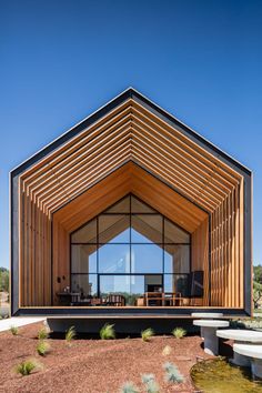 the instagram page on instagram shows an image of a house with wooden walls and windows