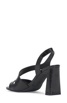 An asymmetric vamp strap creates modern dimension on a slingback leather sandal lofted by a slender block heel. 3 1/4" heel Leather upper/synthetic lining/rubber sole Imported Black Slingback Sandals With Low Heel, Medium Width, Black Open-heel Slingback Sandals For Summer, Black Slingback T-strap Sandals For Beach, Black 4-inch Heel Slingback Sandals, Black Slingback Sandals With 4-inch Heel And Open Toe, Tom Ford Sunglasses, Flip Flop Slippers, Baby Boy Shoes, Comfortable Sandals