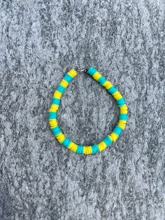 A super fun and colorful clay bead bracelet to wear in the summer! Blue and yellow clay beads make for a vibrant bracelet to match any summer outfit. All bracelets are handmade! Clay Beaded Bracelet, Clay Bead Bracelet, Bead Ideas, Clay Bead, Bead Bracelets, Summer Blue, Blue And Yellow, Clay Beads, How To Make Beads