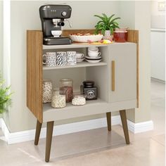 an open shelf with various items on it and a coffee maker in the corner next to it