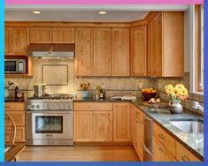 an image of a kitchen setting with wood cabinets and stainless steel appliances on the counter