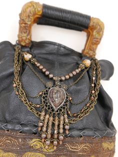 Artisan made unique handbag. Resin and softest black napa leather. Embellished with chains and beads. Brand: Maya 7”(w) x 3”(d) x 8”(h) Handle 2.25”(h) Condition: Excellent Handmade Bohemian Shoulder Bag For Evening, Evening Bohemian Handmade Shoulder Bag, Art Purse, Unique Handbag, Soft Black, Resin Art, 3 D, Purse, Handbags