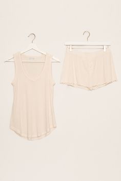 All the soft texture vibes in this 2x2 ribbed sleep set. A soft V-neck tank & mini-button short. Note our "Stone" fabric color is more cream in nature. Comfortable Summer Sleepwear, Ribbed Summer Sleepwear For Lounging, Ribbed Sleepwear For Summer Lounging, Sleeveless Cream Sleepwear For Loungewear, Sleeveless Cream Loungewear Sleepwear, Beige Short Top For Loungewear, Essentials Shorts, Short Note, Sleep Set