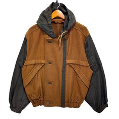 Vintage CP Company Boneville Massimo Osti Zip Up Button Hoodie Light Jacket Brown Size 48 * Made in : Japan * Size on Tag : 48 * Manual Measurement (inch) : Chest 24, Length 25, Shoulder 21, Sleeve 23, Hem 17. * Recommended for Size : Medium (M) & (L) Large  * Material :  Wool, Nylon. * Colour : Brown * Condition : Good Used, with some minor burn mark on sleeve (please see all photos). * See photos for details. BQ Fall Hooded Jacket With Button Closure For Outdoor, Fall Outdoor Hooded Jacket With Button Closure, Hooded Outerwear With Button Closure For Outdoor, Fall Streetwear Utility Jacket With Double-lined Hood, Fall Utility Jacket With Double-lined Hood For Streetwear, Hooded Utility Jacket With Button Closure For Fall, Hooded Fall Utility Jacket With Button Closure, Urban Brown Outerwear With Detachable Hood, Winter Sport Coat With Buttons For Outdoor