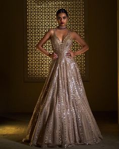 This gold gown features bold sequin embroidery and a criss-cross back. From Seema Gujral's Celeste collection.DELIVERY TIMEPlease allow 8-12 weeks for your outfit to arrive.FABRIC DETAILSNet.Professional cleaning only. Seema Gujral, Reception Gowns, Engagement Gowns, Gold Lehenga, Gown Gold, Reception Gown, Gold Gown, Draping Fashion, Red Lehenga