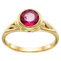 A bright pink, 7 mm round faceted tourmaline rests in a double bezel setting atop a matte-finish split shank design with a delicate spiral motif inside. This ring is currently sized 7.5. It is easily resizable. ...Elegantly simple beauty. Formal Ruby Ring With Bezel Setting, Ruby Ring With Bezel Setting, Elegant Ruby Ring With Bezel Setting, Yellow Gold Ruby Ring With Bezel Setting, Ruby Ring In Yellow Gold With Bezel Setting, Elegant Round Ruby Ring With Bezel Setting, Classic Pink Ruby Ring With Bezel Setting, 14k Gold Ruby Ring With Bezel Setting, Luxury Pink Sapphire Ring With Bezel Setting