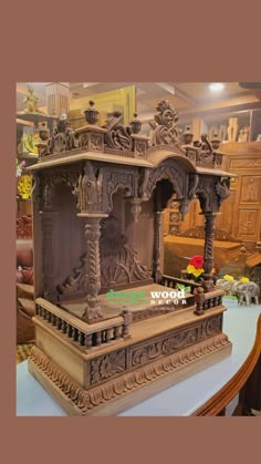 an elaborately carved wooden shrine on display in a store