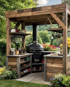 an outdoor kitchen is built into the side of a wooden structure with potted plants