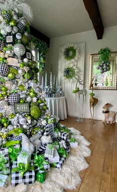 a christmas tree decorated with green and white ornaments