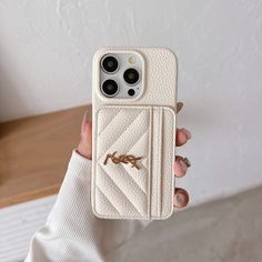 a person holding an iphone case in their hand