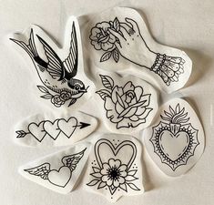 several stickers with tattoos on them are arranged in the shape of hearts and flowers