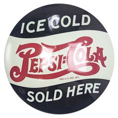 an ice cold pepsi cola sign hanging from the side of a white and black wall