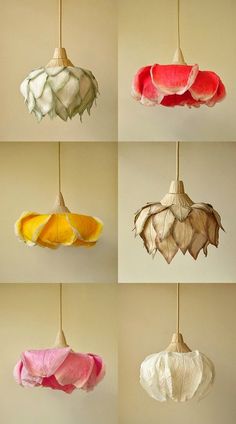 six different colored lamps hanging from strings in various shapes and sizes, each with an ornament shaped like a flower