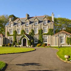 a large gray house with lots of windows