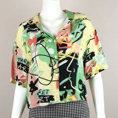 "90s vintage graffiti shirt. - Oversized relaxed fit with notched collar and short sleeves. - Button down front. - Pastel grafitti abstract print. - Viscose material. - Excellent condition. dress + size estimate: s uk: 10 us: 8 eu: 38 measurements: bust: 40\" length: 21\" *visit store here* www.etsy.com/uk/shop/AgeOfVintageUK S/M" Casual Multicolor Hawaiian Shirt With Abstract Print, Retro Graffiti Print Short Sleeve Shirt, Retro Short Sleeve Shirt With Graffiti Print, Trendy Short Sleeve Shirt With Multicolor Print, Trendy Multicolor Print Short Sleeve Shirt, Multicolor Abstract Print Hawaiian Shirt For Summer, Multicolor Hawaiian Shirt With Abstract Print For Summer, Multicolor Hawaiian Shirt With Abstract Print, Multicolor Graphic Print Hawaiian Shirt For Streetwear