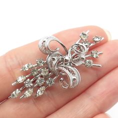 Great antique condition. 925 Sterling Silver Antique Am Lee Rhinestone Filigree Pin Brooch Weight: 5.6g WELCOME TO PAWN SHOP We are an actual pawn shop and have been in business for over 25 years. Since 1990, our establishment has been serving a variety of clients by providing them with short term cash solutions and options of liquidity regarding their treasured heirlooms. Acknowledging that today′s customers are very sophisticated and are looking for a variety of investments, our acquisitions a Vintage Brooches With Sparkling Stones For Gift, Antique Rhinestone Brooches For Anniversary, Vintage Brooches With Sparkling Stones As Gift, Vintage Anniversary Brooch With Sparkling Stones, Antique Silver Diamond Brooch, Antique Silver Diamond Brooches, Vintage Silver Brooches With Sparkling Stones, Vintage Diamond Brooches With Filigree, Vintage Diamond Brooches Hallmarked